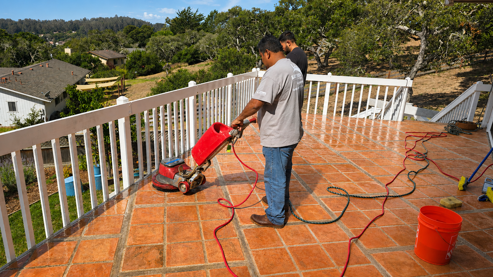 Bay Area Floors PIT team cleaning tile on an outdoor patio